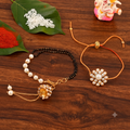 Elegant Pearl & Black Bead Mangalsutra Bracelet and Floral Rakhi Gift Set for Sister